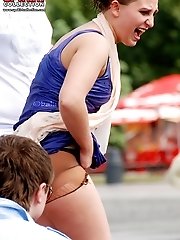 12 pictures - Lifting skirt up and stretching pussy in voyeur upskirt free photo gallery from UpskirtCollection.com